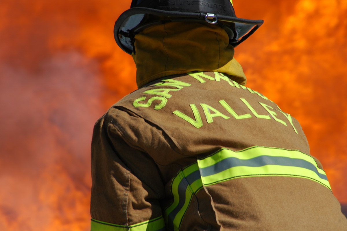 San Ramon Valley Firefighter in front of flames