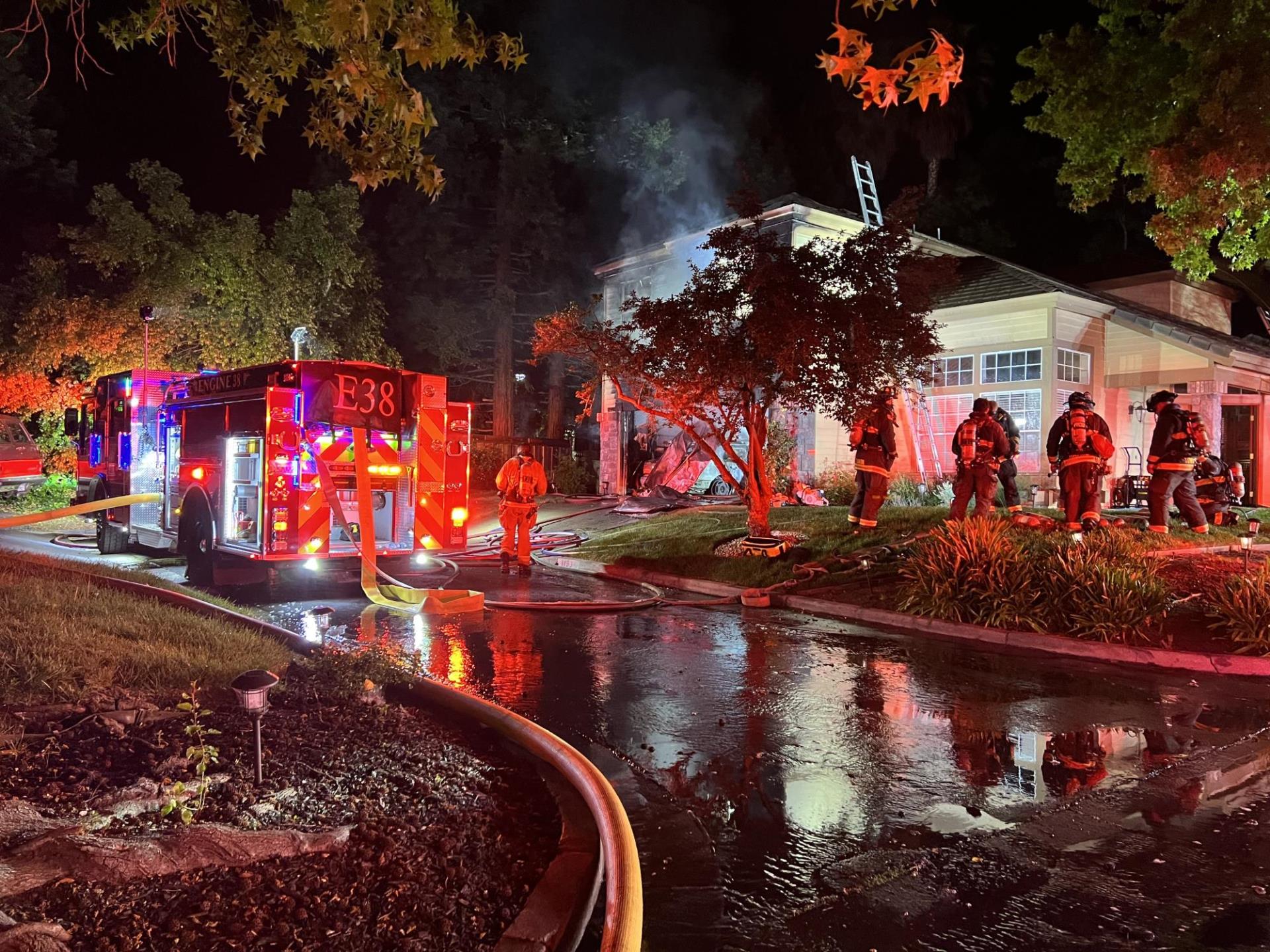 Engine 38 in front of house fire