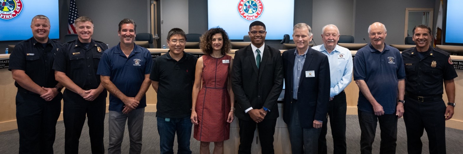 Nathaniel “Nate” Jackson, Jr., with College Board Vice President Li, Chancellor Mehdizadeh, Fire Board Members, Fire Chief Meyer, Deputy Chief Aguair, and 3546-L President Duggan.